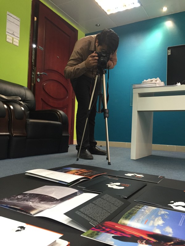We can also do serious. Here is our graphic designer shooting our products for our portfolio.